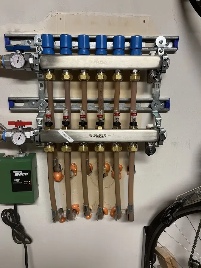 Plumber performing Water Heater Repair at a residential property in Rush